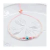 CANDIES - BRACELET 25 PERLES SOUCOUPES, 6 SPINELLES MULTICOLORES ET OEIL ROND SUR CORDON