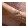DAISY - BRACELET CORDONS LUREX, 3 FLEURS ET 2 TUBES FLEURS