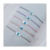 WATCH ME - BRACELET OEIL OVALE - PLUSIEURS COULEURS DE CORDON